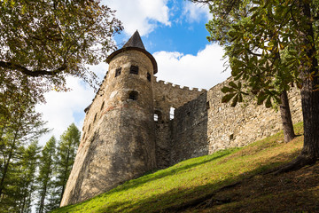 Fototapeta na wymiar Old stone tower with loopholes. Castle in Stara Lubovna.