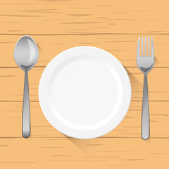 empty white plate with spoon and fork