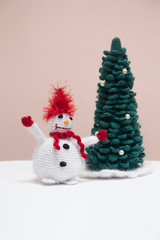 knitted snowman with Christmas tree