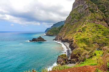 Fototapeta na wymiar Mountains and ocean, northern coast near Boaventura, Madeira