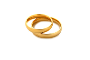 Golden wedding rings isolated on a white