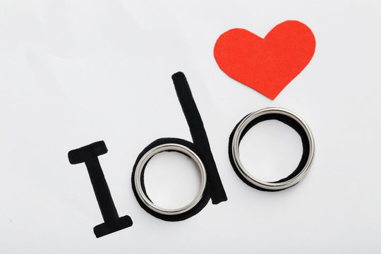 Silver Wedding Rings With Red Heart And Words I Do