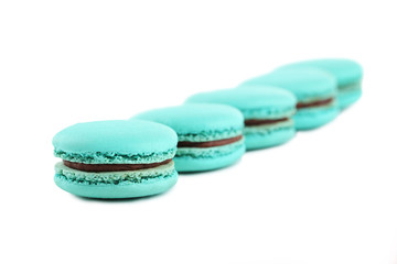 Tasty blue macarons isolated on white