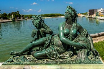 Fototapeta na wymiar Sculptures in garden of Versailles Palace. Versailles, France.