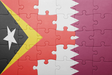 puzzle with the national flag of east timor and qatar