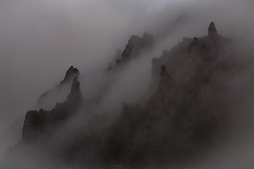 Mystic rocks in the fog. Magadan Region. Koni peninsula. Russia.