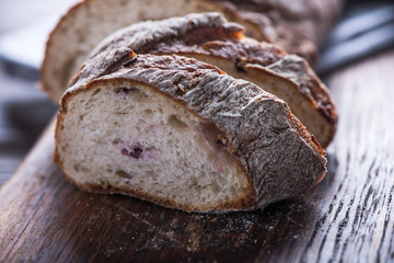 Sharing homemade bread loaf