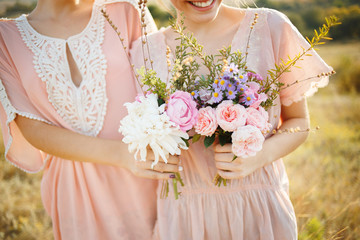 beautiful bridesmaids with bouquets in their hands