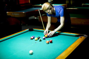 Young man playing snooker