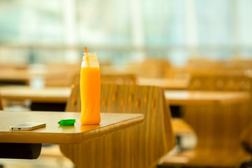 Bottle of orange juice on table.