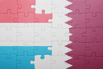 puzzle with the national flag of luxembourg and qatar