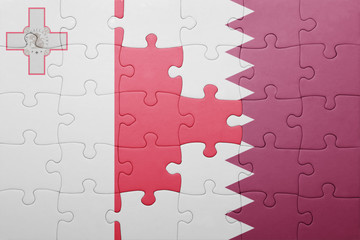puzzle with the national flag of malta and qatar