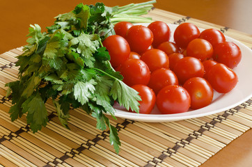 Plate with cherry tomatoes and parsley