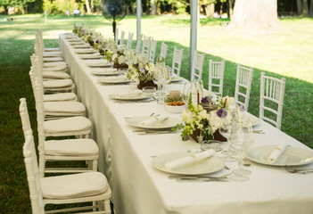 Luxury wedding lunch table setting outdoors
