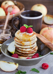 Breakfast with apple pancakes with honey
