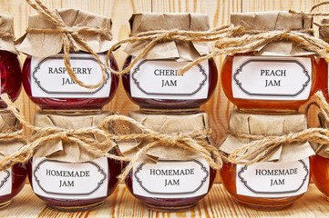 Homemade jams on a wooden shelf