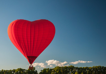 Flight on a balloon in the shape of a heart.