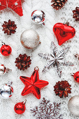 Christmas and New Year background with decorations - balls, stars, heart, pine cones.