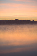 Obraz na płótnie Canvas Foggy morning on the country lake - vintage effect