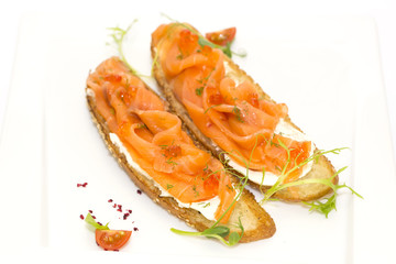 sandwiches with salmon caviar and greens adorned