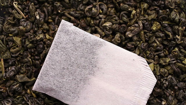 Green tea leaves close up rotation