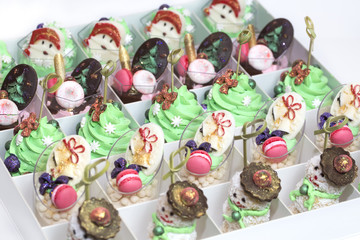 Christmas dessert canapes with cream and chocolate on a white background