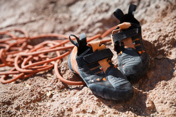 Rock climbing shoes over belay rope closeup
