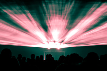 Laser show rays in red and green colors. Best visual show with a crowd silhouette and great laser rays for e.g. an illustration background of an invitation flyer