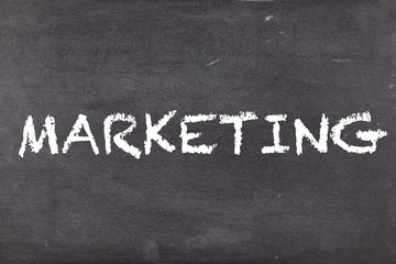 Fototapeta premium Marketing, concept on school blackboard or chalkboard