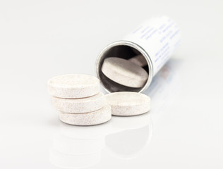 Fototapeta na wymiar vitamin d supplements on white background