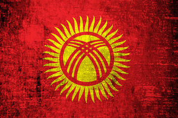 Obraz na płótnie Canvas Kyrgyzstan Flag painted on wood background 