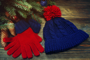 Fashion set of classic winter clothing. Warm woolen knitted hat and mittens on Christmas...