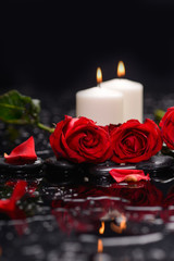 Still life with red rose with candle and therapy stones 
