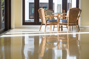 table and chairs in living room with reflection