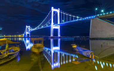 Da Nang, Vietnam - June 24th, 2015: Thuan Phuoc cable stayed bridge reflected on river lights...