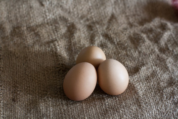 Still Life- laying eggs on burlap.
