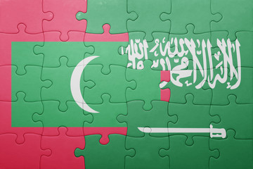 Fototapeta premium puzzle with the national flag of saudi arabia and maldives