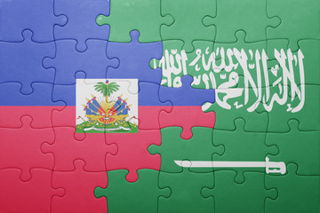 Fototapeta premium puzzle with the national flag of saudi arabia and haiti