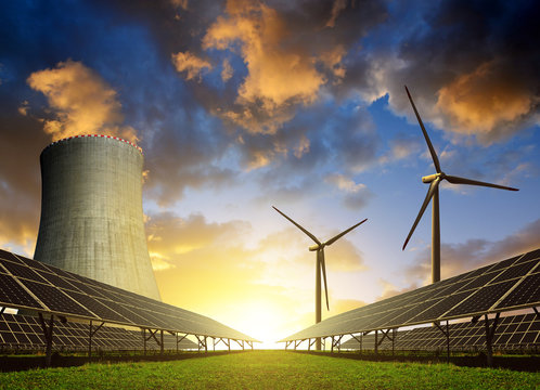 Solar Energy Panels, Wind Turbines And Nuclear Power Plant At Sunset.