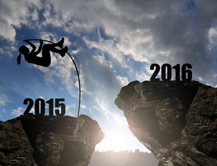 Girl jumps to the New Year 2016 at sunset