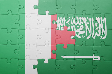 puzzle with the national flag of saudi arabia and italy
