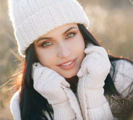 Autumn portrait of a beautiful woman in the field