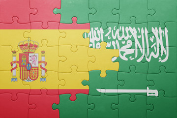 puzzle with the national flag of saudi arabia and spain