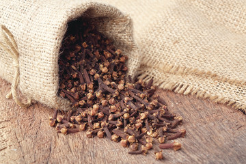 Aromatic dried clove flower buds in sackcloth bag
