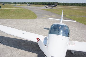 Pilot in aircraft with thumbs up