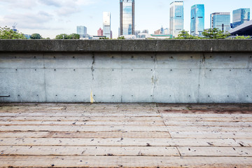 skyline and cityscape on view of empty wooden floor