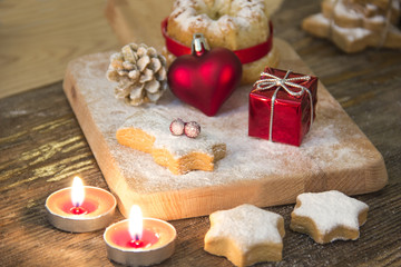 Fototapeta na wymiar Christmas background with christmas gingerbread cookies and candles on wooden