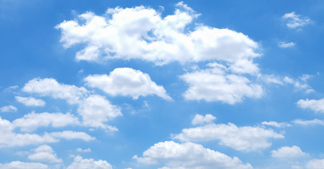 Fototapeta na wymiar White sparse clouds on blue sky