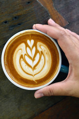 a cup of latte art coffee.