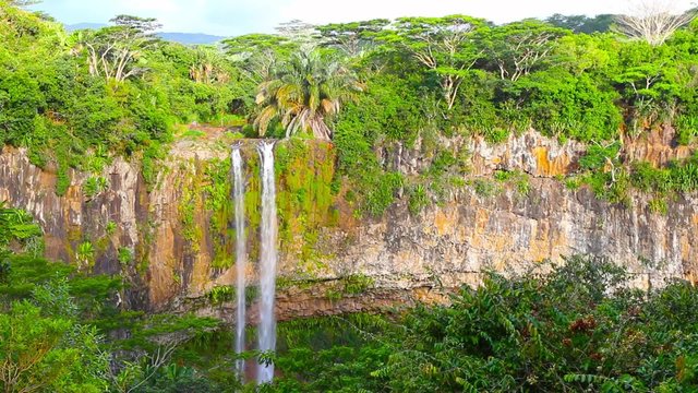 Waterfall in rainforest. Chamarel Falls is a scenic location and nature attraction on Mauritius Island. 